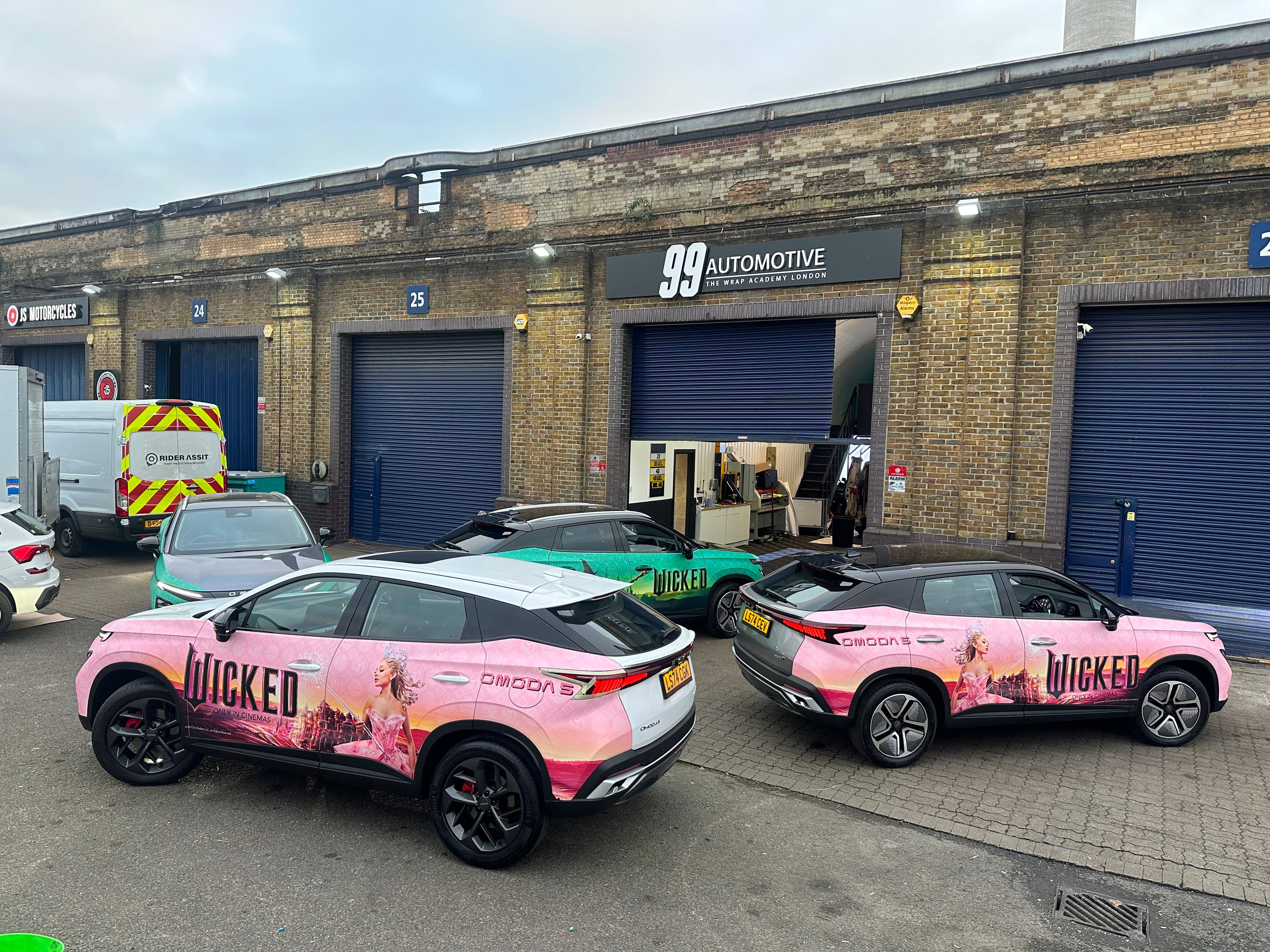 Wicked-wrapped Omoda fleet outside the Wrap Academy London unit
