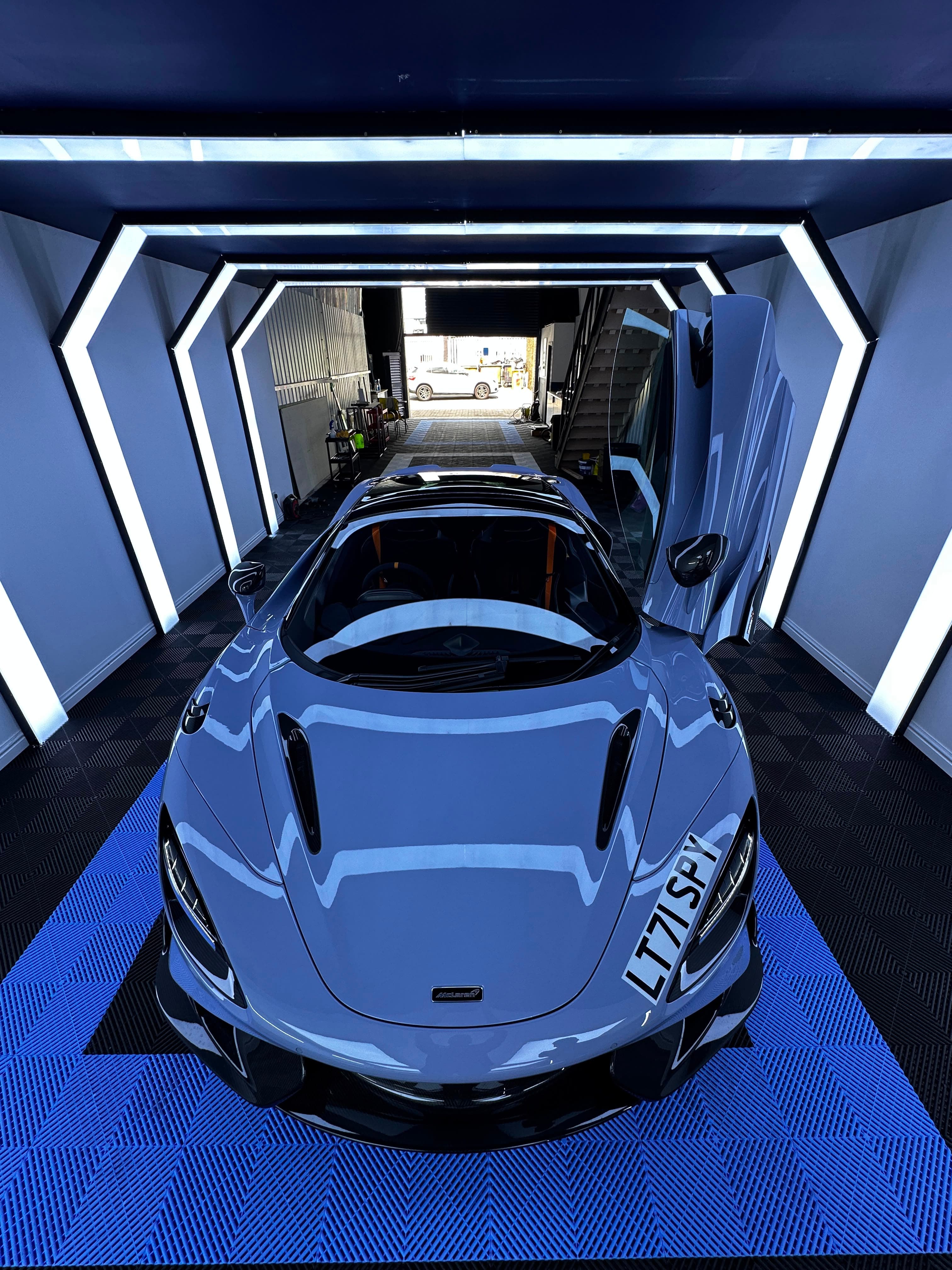 McLaren 765LT, high front angle, orange belts, door open